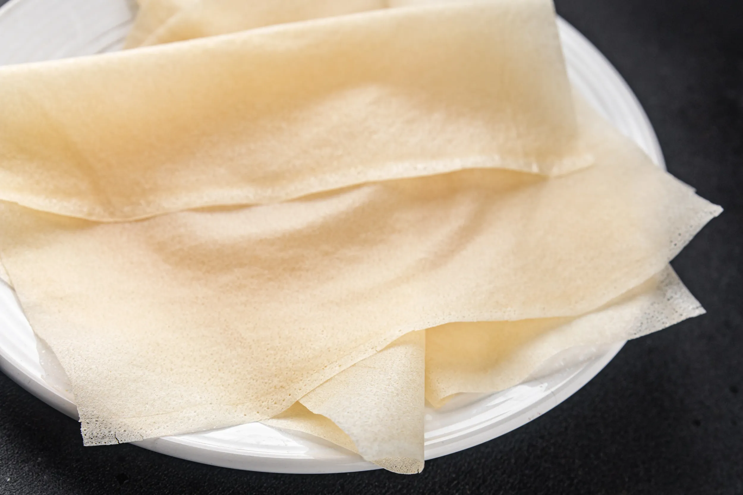 brik-dough-thin-sheet-raw-packaging-dough-phyllo-fresh-delicious-gourmet-food-background-table-rusti