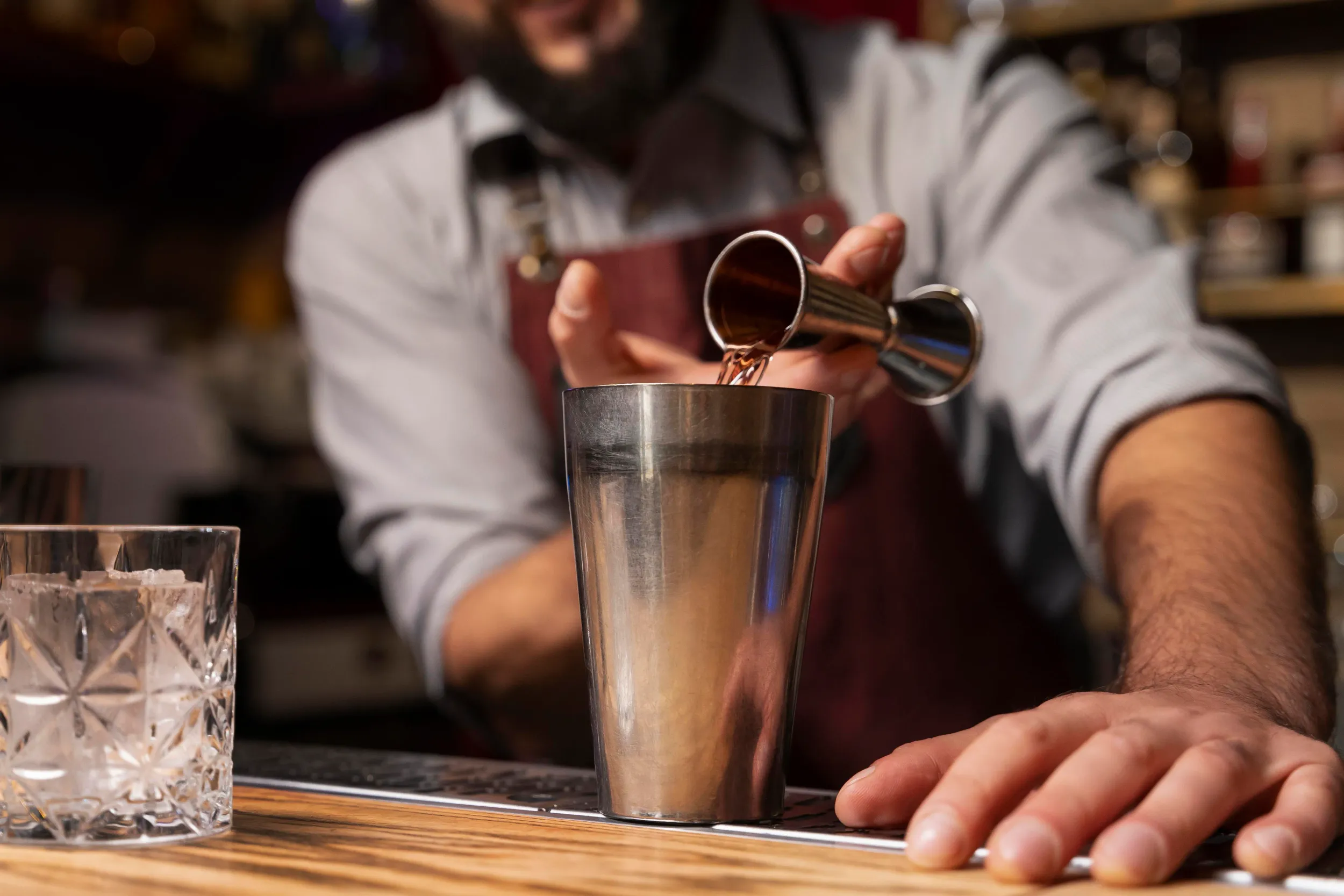 close-up-bartender-cocktail-shaker