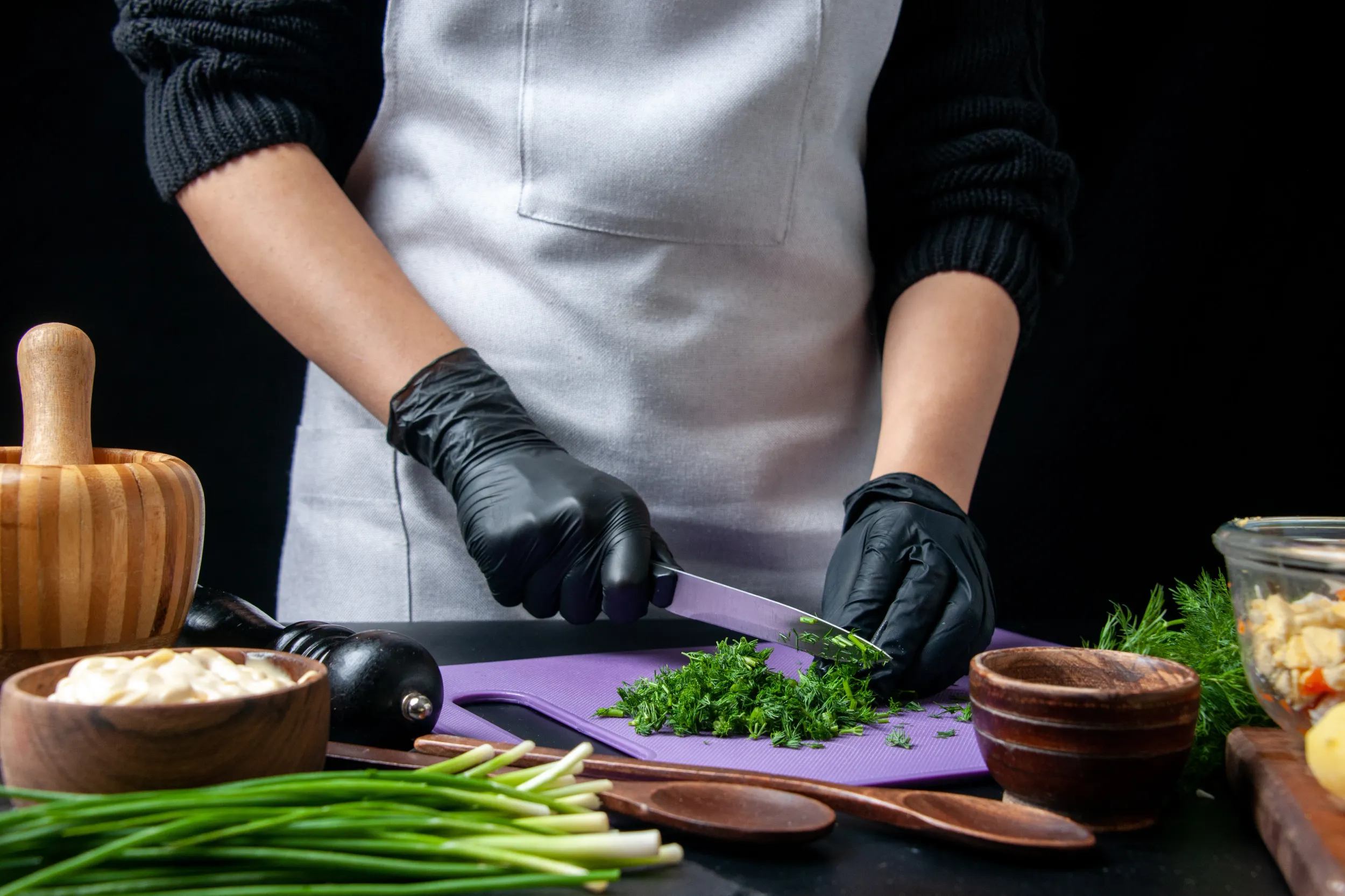 front-view-female-cook-making-vegetable-salad-cutting-greens-dark-background-kitchen-holiday-work-food-meal-job-color-cuisine