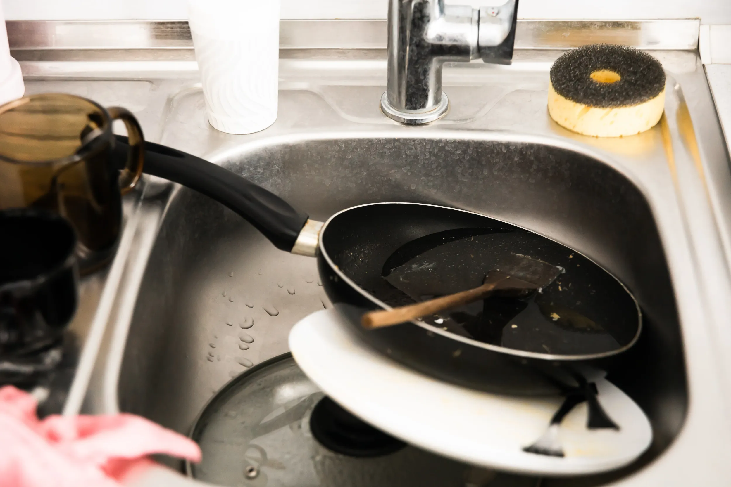 metal-sink-full-dirty-dishes-crockery-tableware