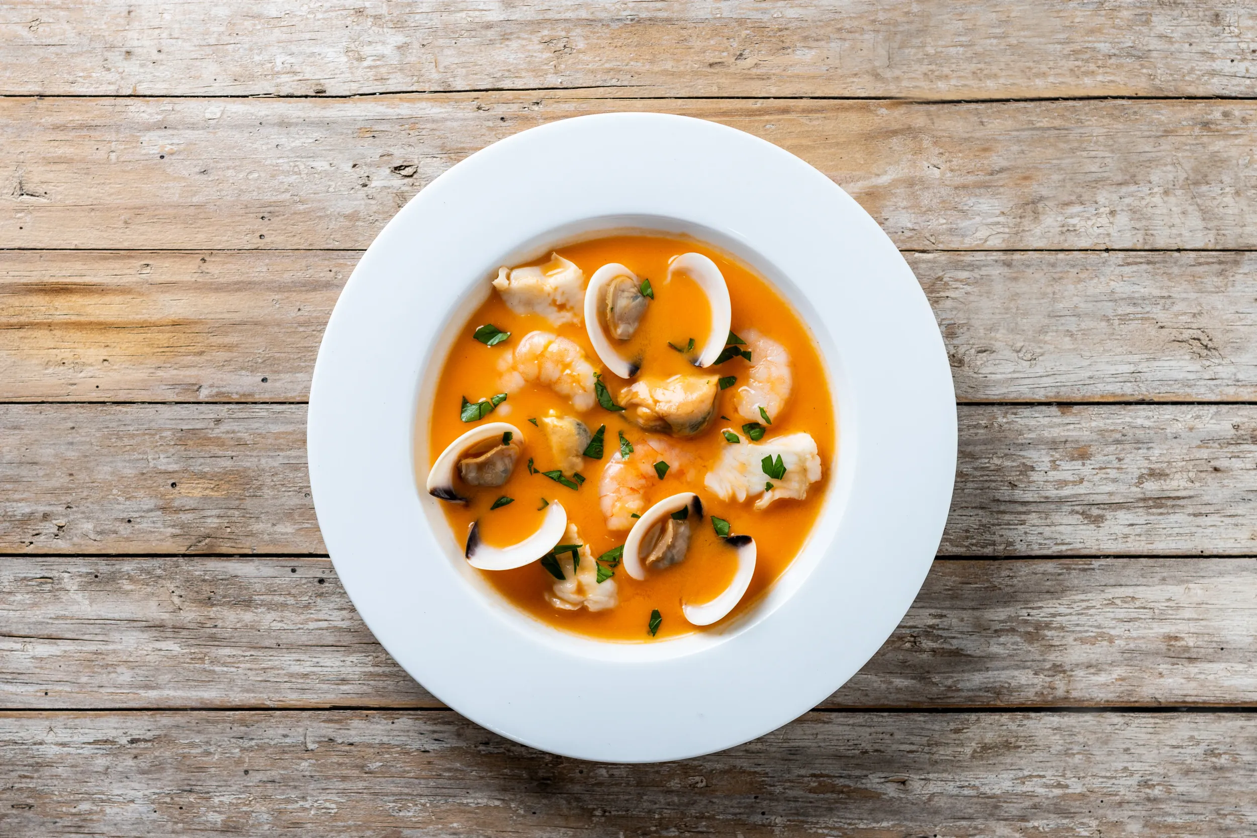 seafood-soup-wooden-table