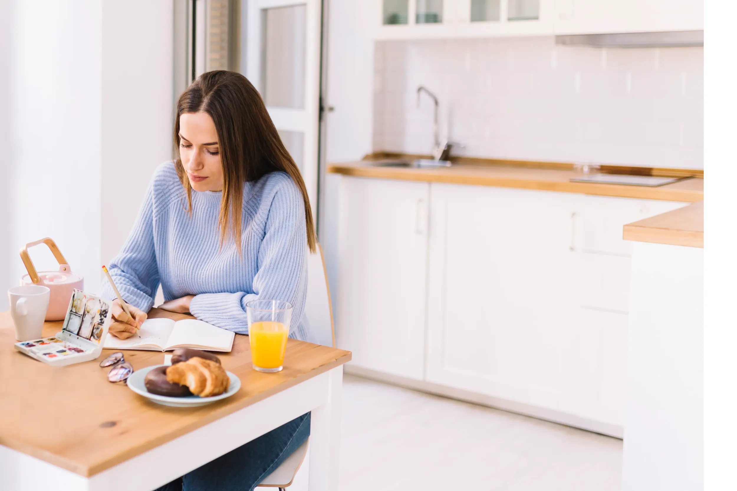 serious-woman-drawing-kitchen