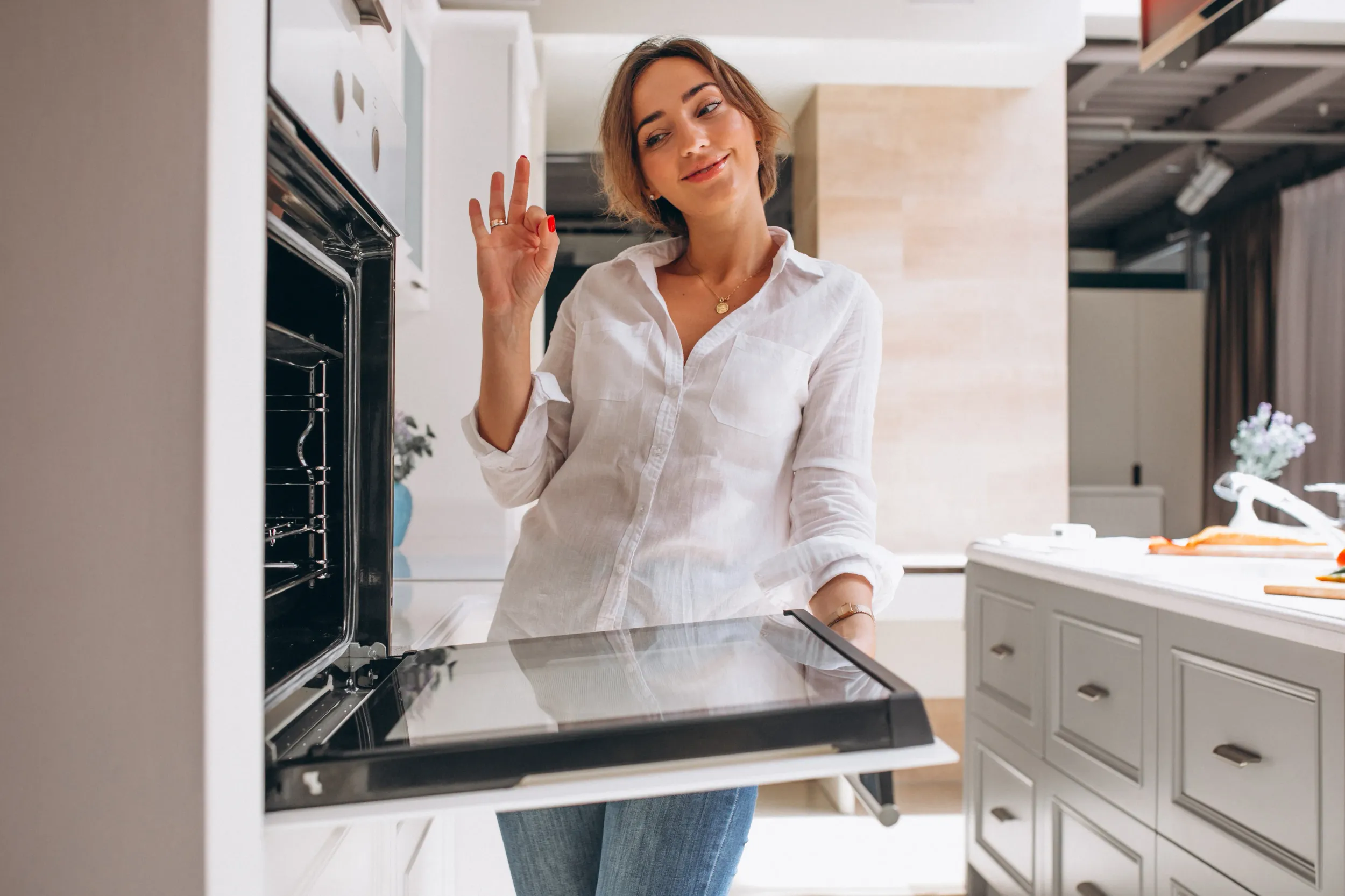 woman-baking-kitchen-looking-into-oven